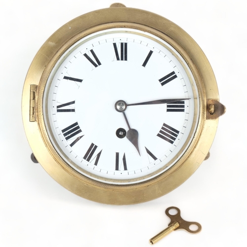 289 - A Vintage brass-cased ship's bulkhead clock with enamel dial, diameter 18.5cm overall