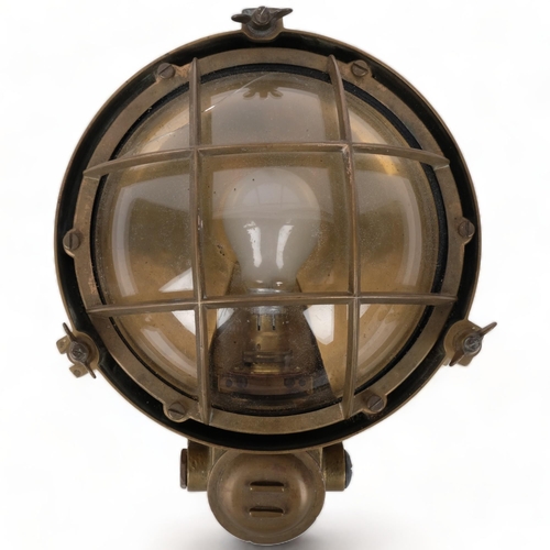 290 - A Vintage brass-cased ship's bulkhead lamp, with dome glass lens, H31cm overall (glass cracked)