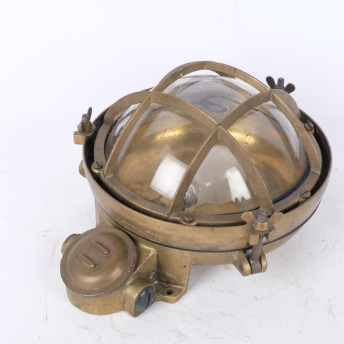 290 - A Vintage brass-cased ship's bulkhead lamp, with dome glass lens, H31cm overall (glass cracked)