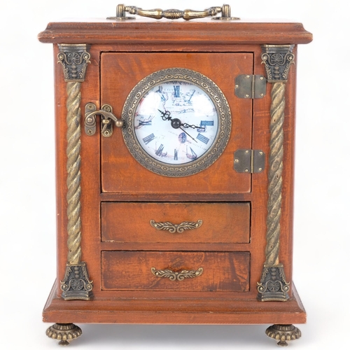 294 - A stained wood jewellery box with an inset quartz movement clock. The hinged door opening to a drawe... 