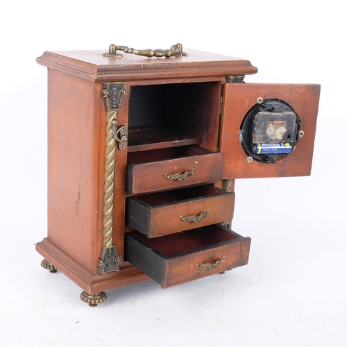 294 - A stained wood jewellery box with an inset quartz movement clock. The hinged door opening to a drawe... 