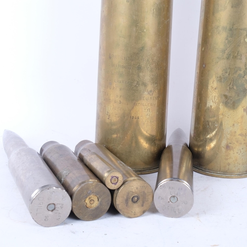 334 - 2 x 1950s brass shell cases, 29cm, 2 smaller shell cases, and 2 shells