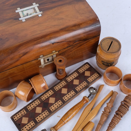 336 - Antique walnut box with inlaid mother-of-pearl motifs, containing Mauchline Ware and treen items, in... 