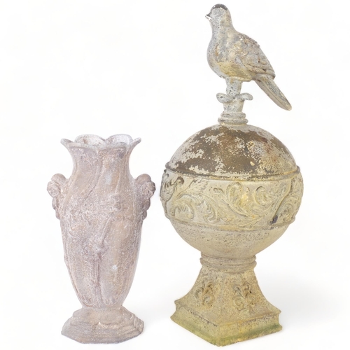 349 - A verdigris metal garden ornament, depicting a bird on a globe, 49cm, and a metal vase with embossed... 