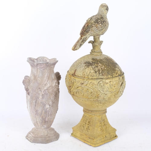 349 - A verdigris metal garden ornament, depicting a bird on a globe, 49cm, and a metal vase with embossed... 