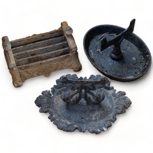 355 - An ornate Victorian cast-iron boot scraper, 36cm across, and 2 others