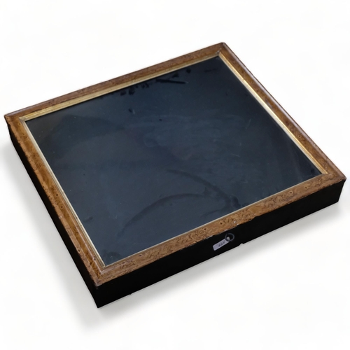 357 - A wooden-framed table-top display case with glazed lid, L58cm