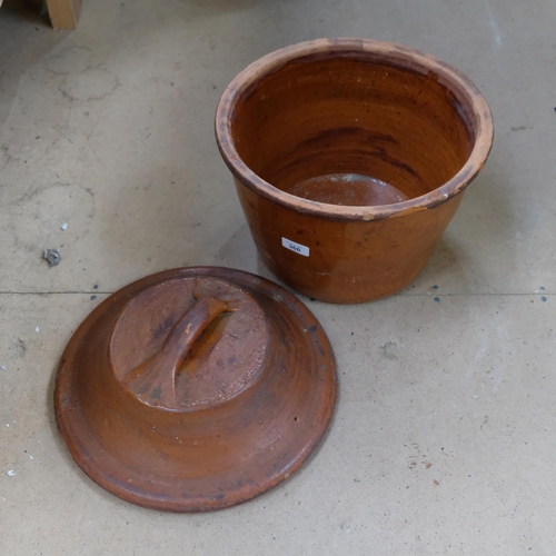 360 - Antique glazed terracotta crock and cover, 34cm across