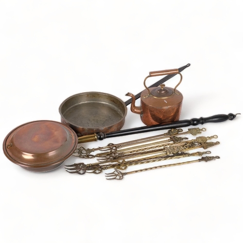 362 - A copper kettle, Antique copper pan with iron handle, toasting forks, and a bed-warming pan