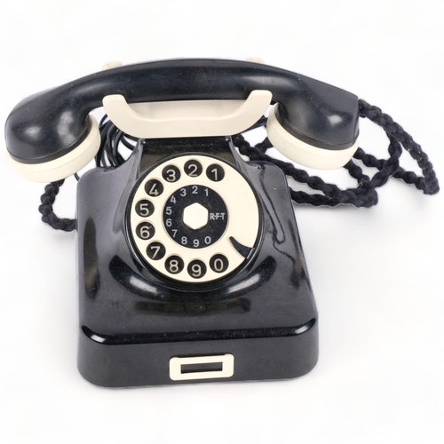 378 - A Vintage RFT black and cream plastic dial telephone