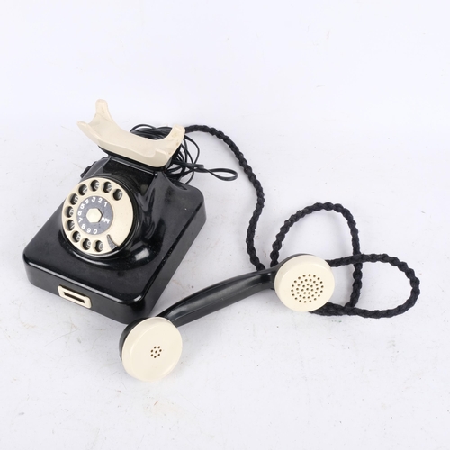 378 - A Vintage RFT black and cream plastic dial telephone