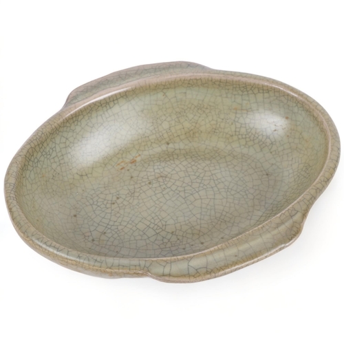 383 - A crackle glaze celadon ware shallow dish with 2 handles, 12.5cm