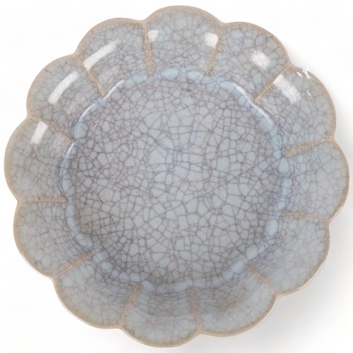 385 - A crackle glaze shallow Chinese dish with scalloped edge, 19cm across