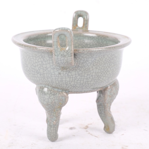 386 - A Chinese celadon crackle glaze censer, on tripod support, 11.5cm across