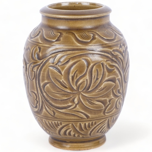 388 - An Oriental stoneware glazed pot with incised floral decoration, H15cm