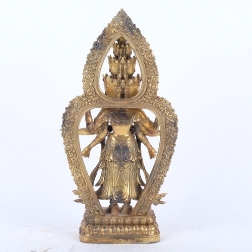 400 - A gilt-bronze multi-faced Buddha figure, inset with jewels, on lotus base, H27cm