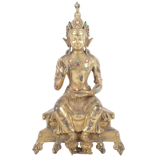 402 - Oriental gilt-bronze Buddha with stone set decoration, on stand, H24cm