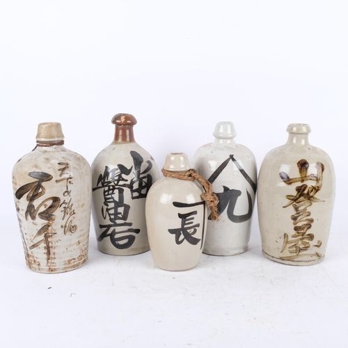 410 - 5 various Japanese Sake bottles with inscriptions, 26.5cm