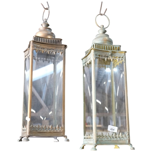 424 - A pair of square framed verdigris copper lanterns, with ring handles, 15cm across