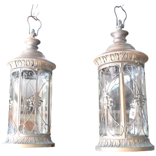 425 - A pair of circular copper 4-panel glass lanterns, 23cm diameter