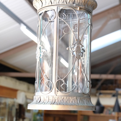 425 - A pair of circular copper 4-panel glass lanterns, 23cm diameter