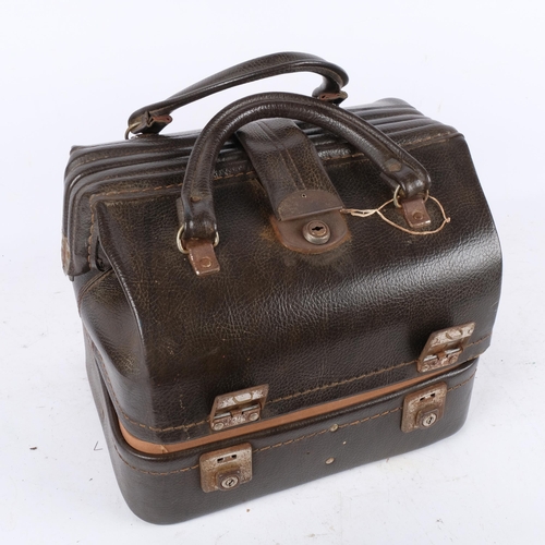 427 - An unusual bag with the base fitted with Henselite bowling balls, 34cm across