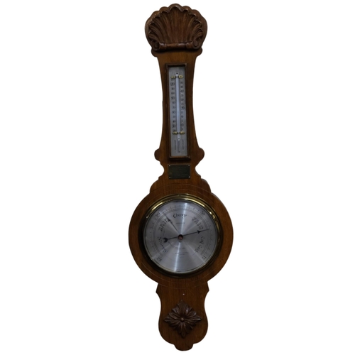 442 - A Negretti & Zambra aneroid barometer, in carved oak case, with presentation plaque for 1952, 74cm