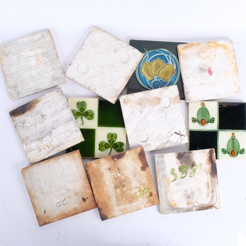 493 - A group of 11 decorative Edwardian and other tiles, 15cm