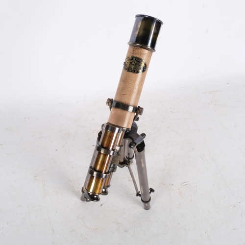 495 - A reproduction telescope on tripod folding base, telescope length 26cm