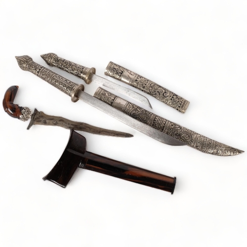 69 - A small Indonesian kris dagger and scabbard, dagger length 27cm, together with a graduated pair of M... 