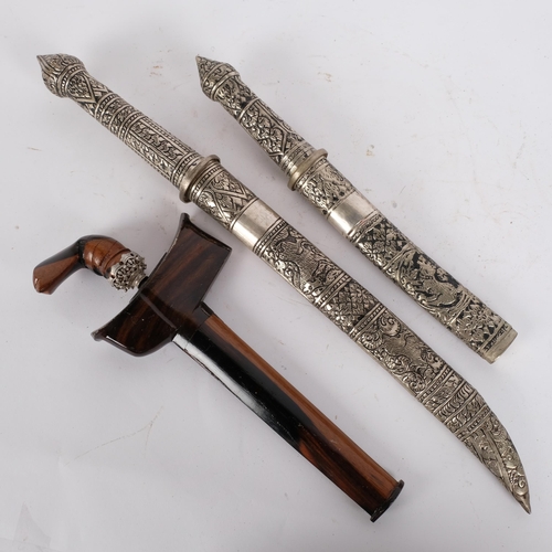 69 - A small Indonesian kris dagger and scabbard, dagger length 27cm, together with a graduated pair of M... 