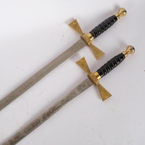 75 - A pair of Elizabeth II commemorative swords, by Wilkinson Sword Company, etched blades and brass hil... 