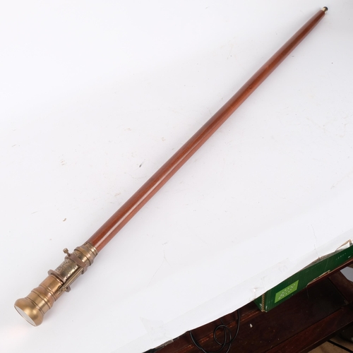 77 - A reproduction gadget cane, the top set with a compass and 2-draw telescope, L99cm