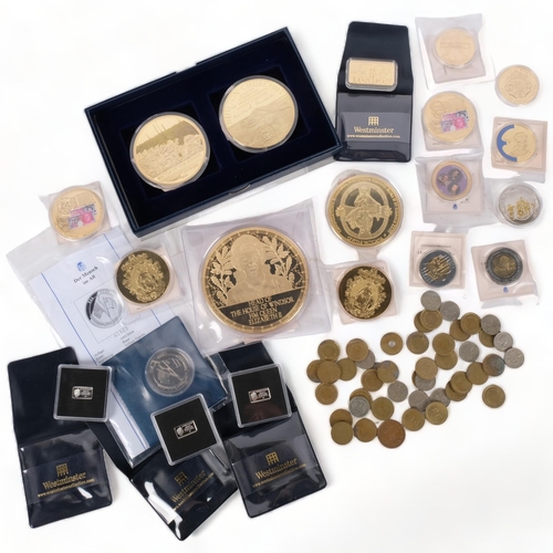 89 - A collection of commemorative coins and medallions, subjects to include Winston Churchill, Queen Eli... 