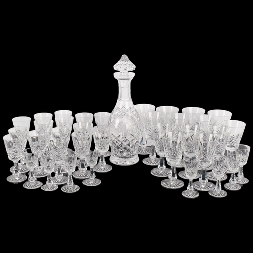 512 - A Waterford Crystal decanter and stopper, 33cm, and a suite of matching glasses, comprising 7 wine g... 