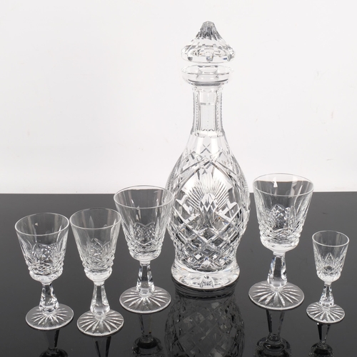 512 - A Waterford Crystal decanter and stopper, 33cm, and a suite of matching glasses, comprising 7 wine g... 