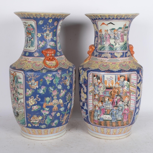 518 - A pair of Oriental blue ground vases, with figure decorated enamelled panels, H46cm