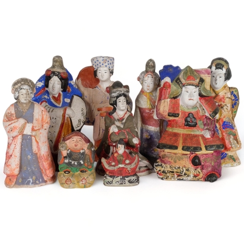 521 - A group of 9 various Japanese painted figures, tallest 31cm