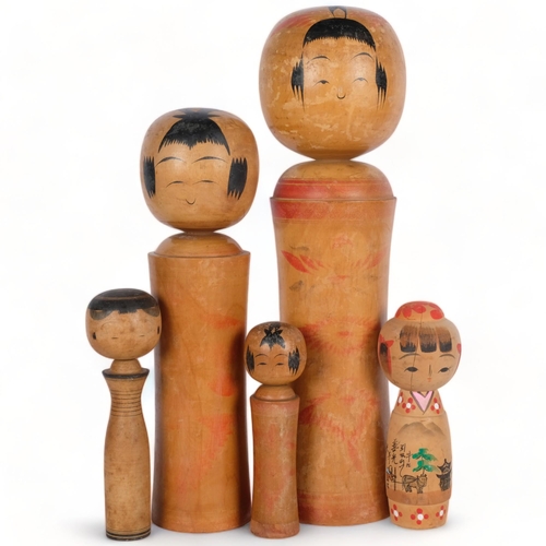 524 - A group of 5 painted Japanese wood Kokeshi dolls, tallest 46cm