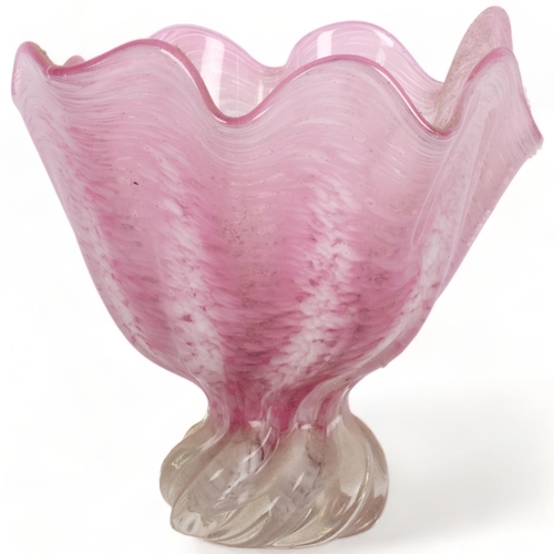 529 - A pink Art glass vase with wavy rim, on clear base, probably Murano, 22cm