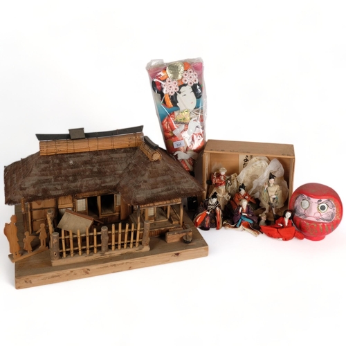 535 - A handmade Japanese wooden building, figures, dolls, etc, and a glazed cabinet containing various fi... 