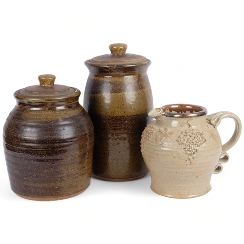 547 - 2 glazed stoneware pots and covers, tallest 36cm, and a jug with moulded grapevine decoration