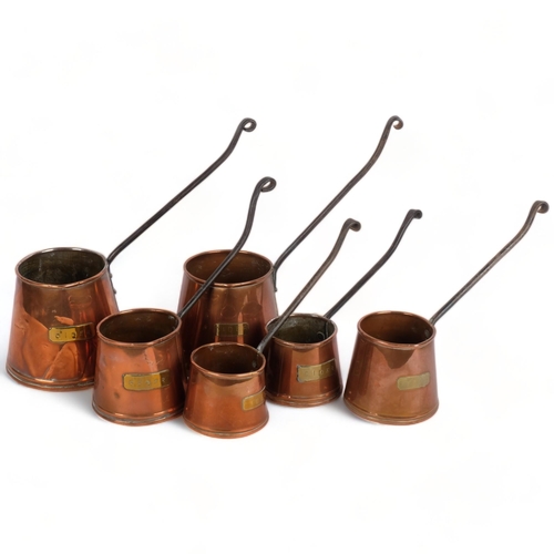 550 - 2 similar graduated sets of copper cider measures, with brass plaques