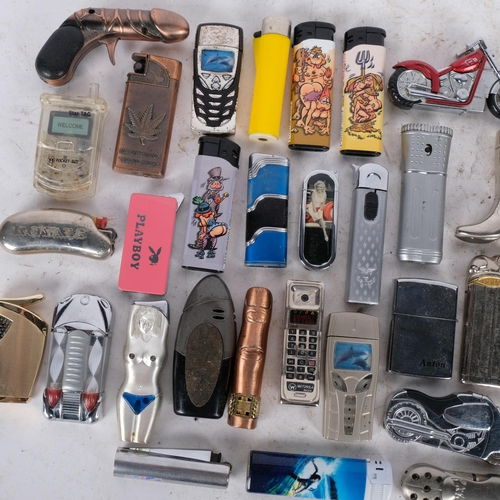 553 - A collection of novelty pocket cigarette lighters, etc