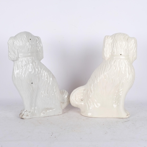 556 - A large matched pair of King Charles Spaniel Staffordshire dogs, H41cm