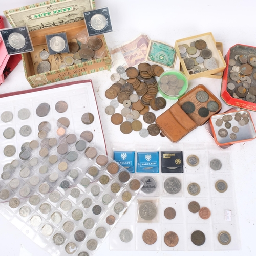 564 - A box of British and foreign coins, bank bags, commemorative coins, etc