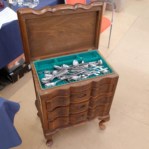 570 - A Chinese carved hardwood cutlery floor standing cabinet, fitted with three drawers and rising lid, ... 