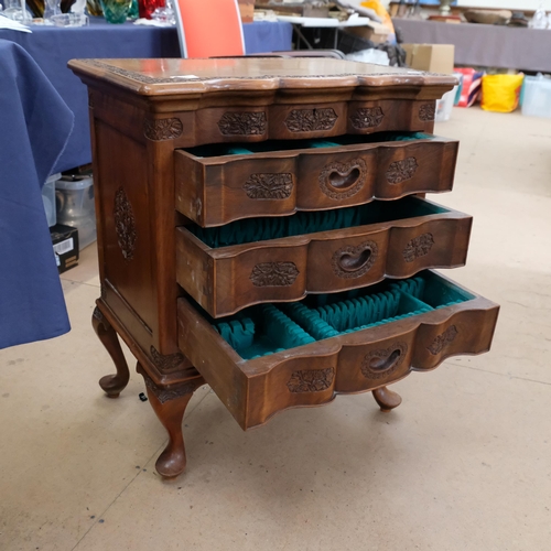 570 - A Chinese carved hardwood cutlery floor standing cabinet, fitted with three drawers and rising lid, ... 