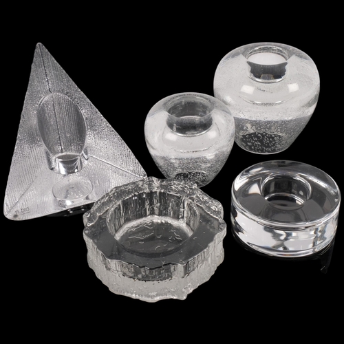 585 - A group of glass candle holders, including a triangular crystal-cut candle holder, by Nybro of Swede... 