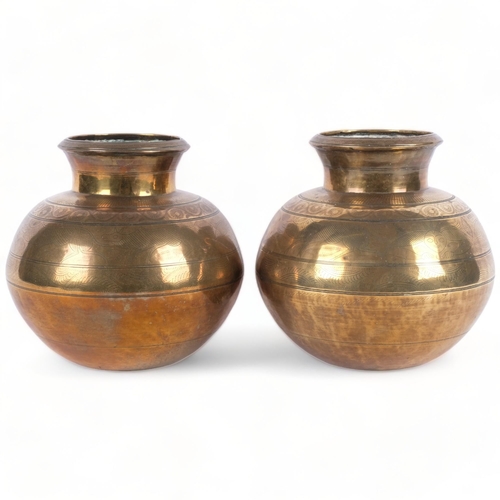 596 - A pair of 19th century Indian heavy gauge brass vases, with engraved animals and geometric bands, he... 